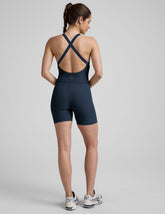 blue biker jumpsuit with a built-in shelf bra and 5" inseam.